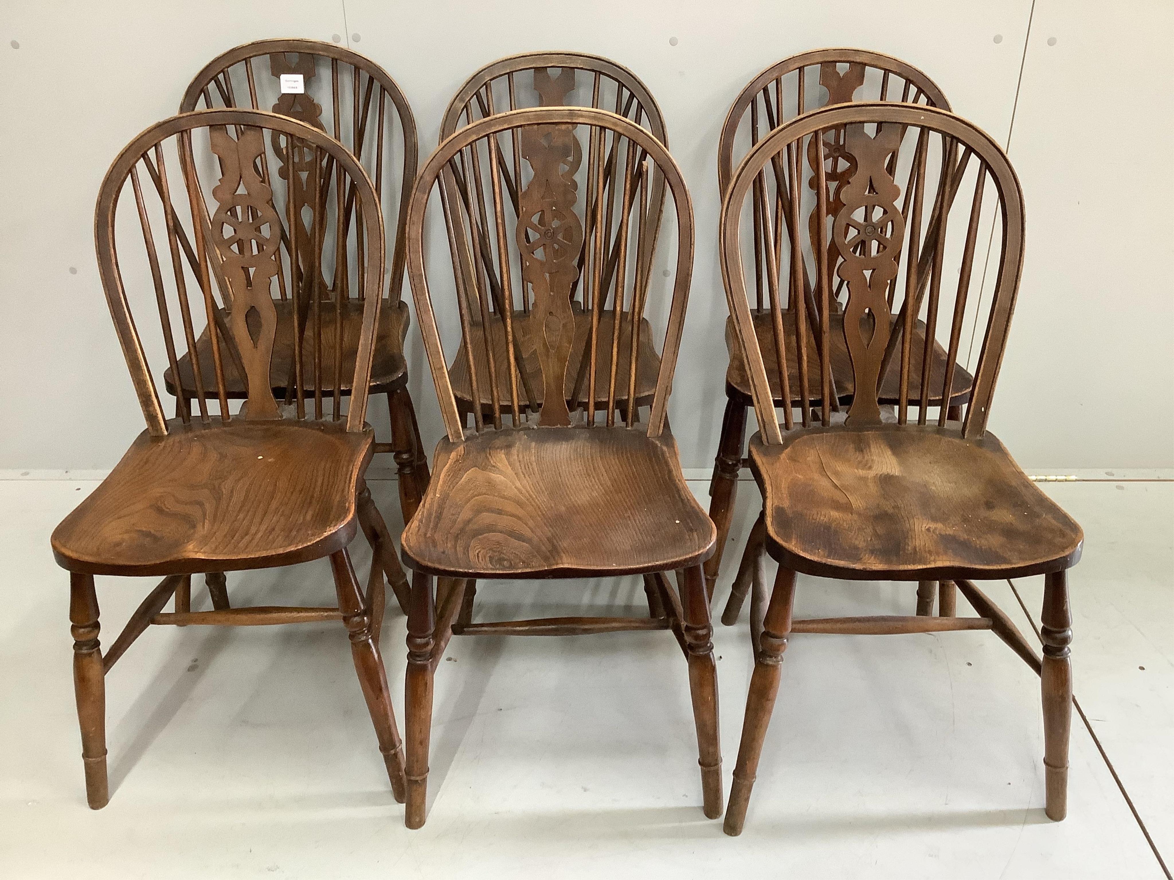 Six Victorian ash, elm and beech Windsor wheelback dining chairs. Condition - poor to fair